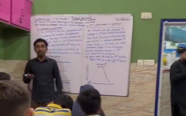 Teacher explaining on the board